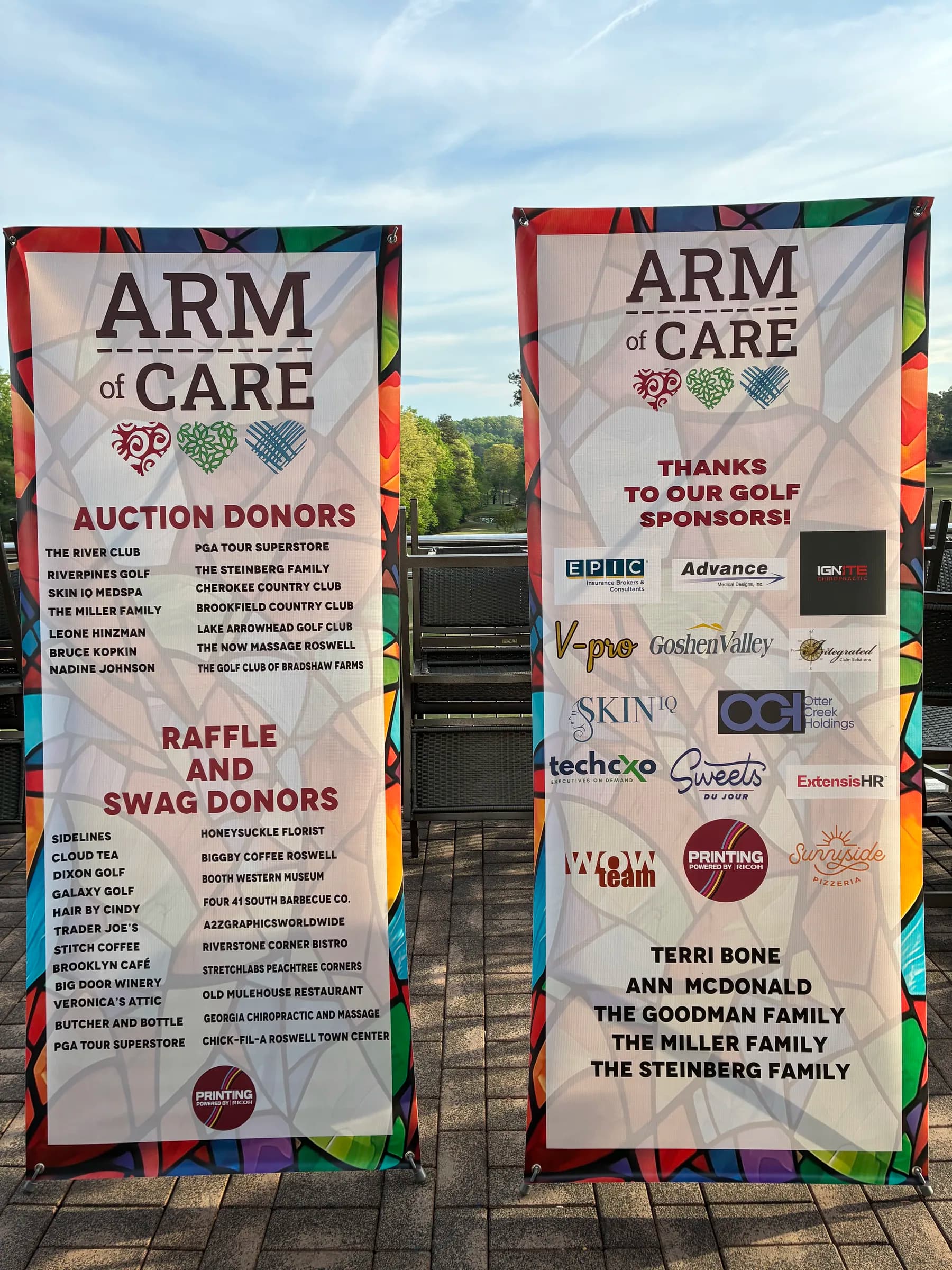 ARM of Care golf fundraiser sponsor and donor banners including V-Pro