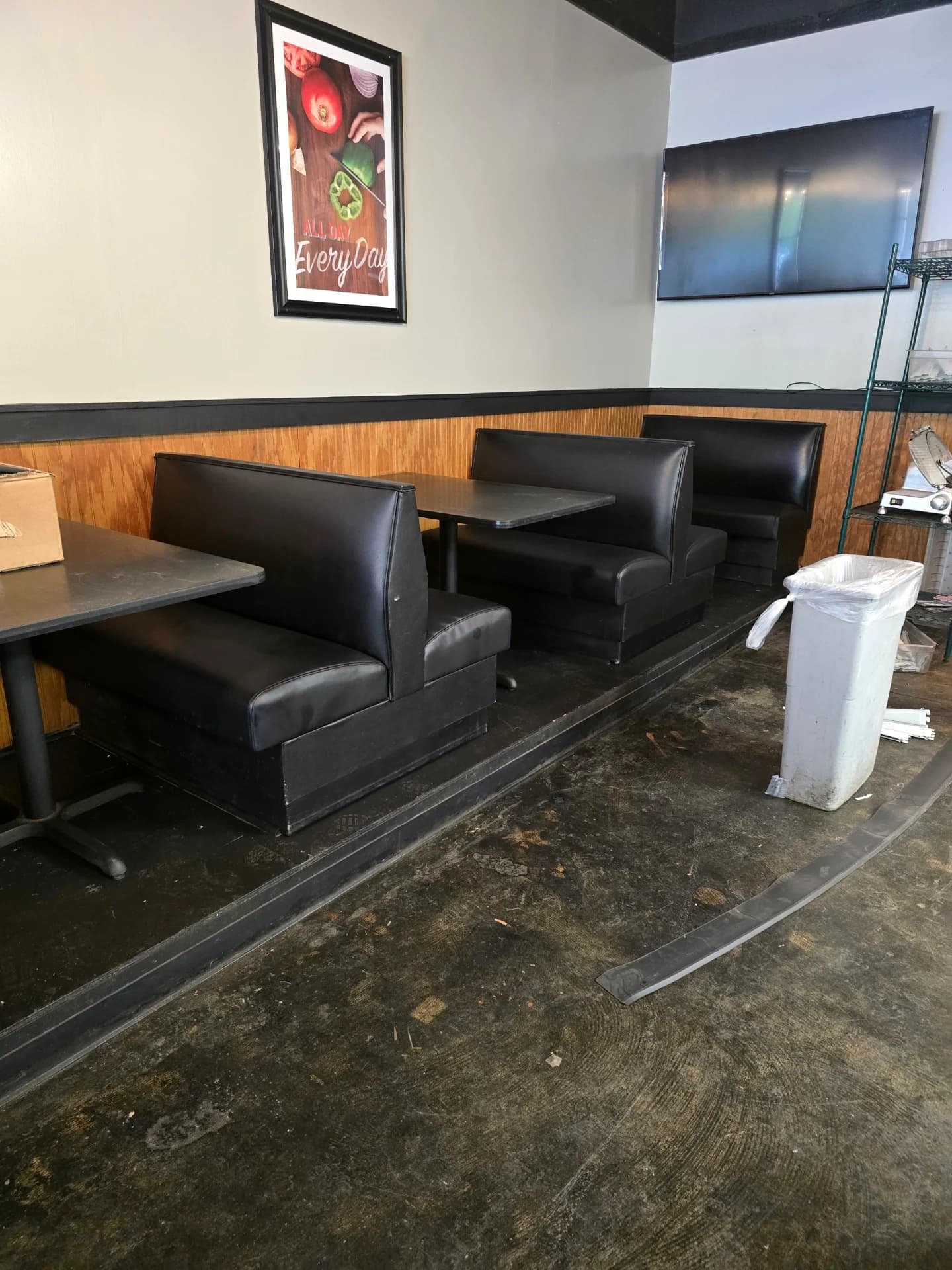 Completed black vinyl restaurant booth reupholstery