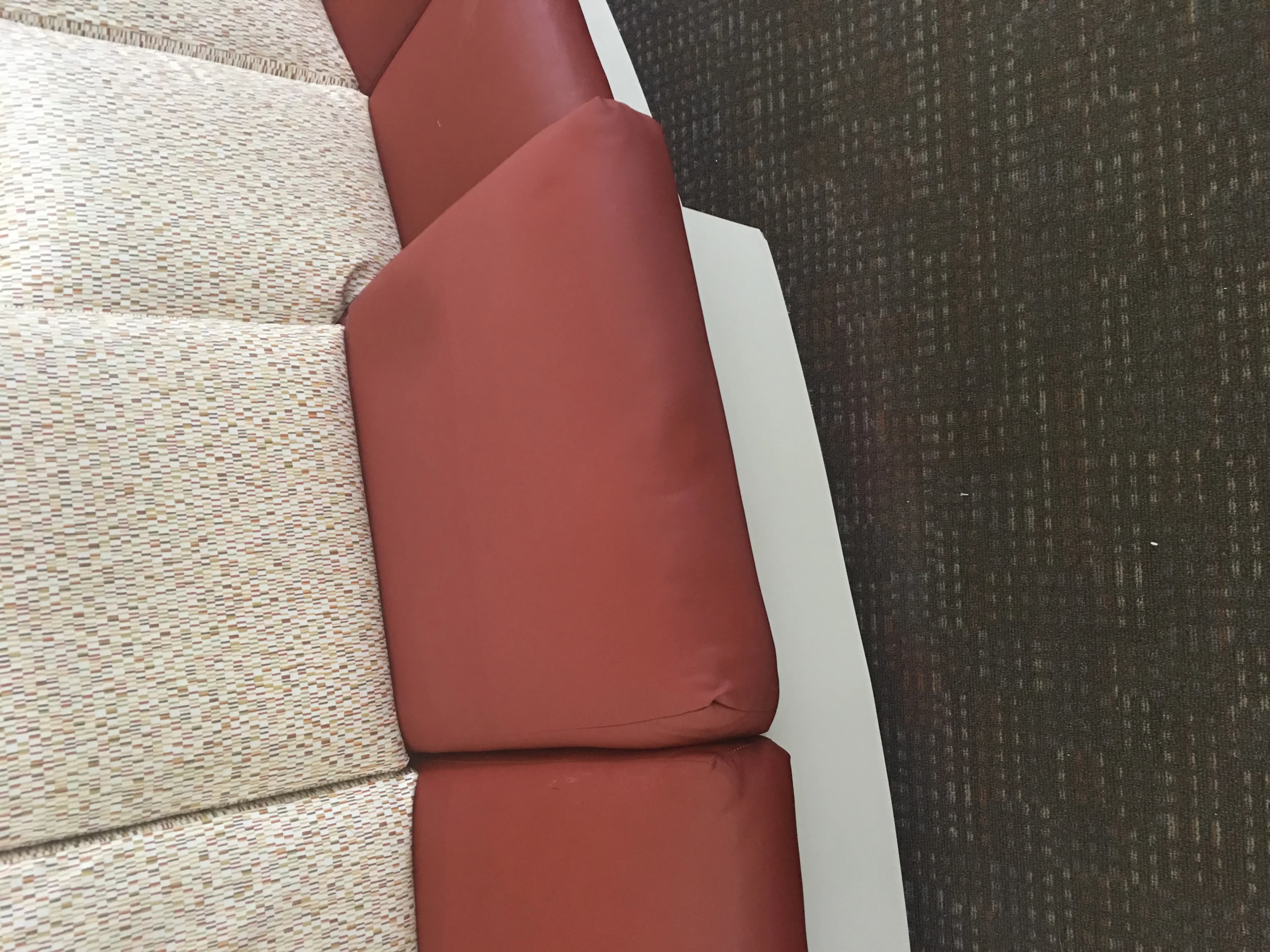 Rust red commercial booth cushions showing professional upholstery work
