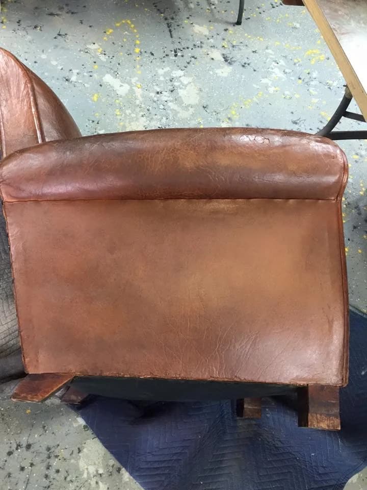 Vintage leather club chair after restoration